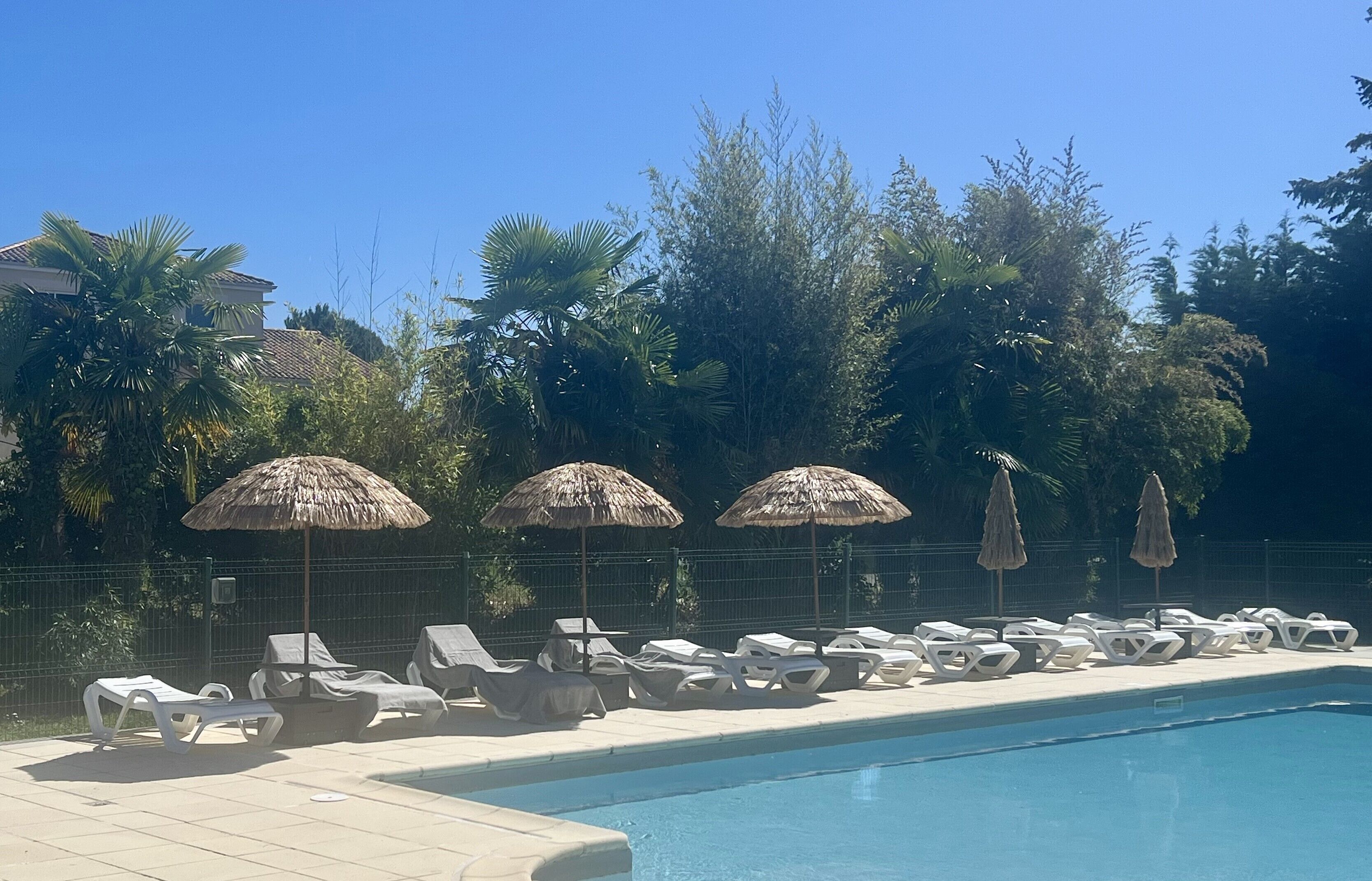 Seasonal outdoor pool, open 10:00 AM to 9:00 PM, pool loungers