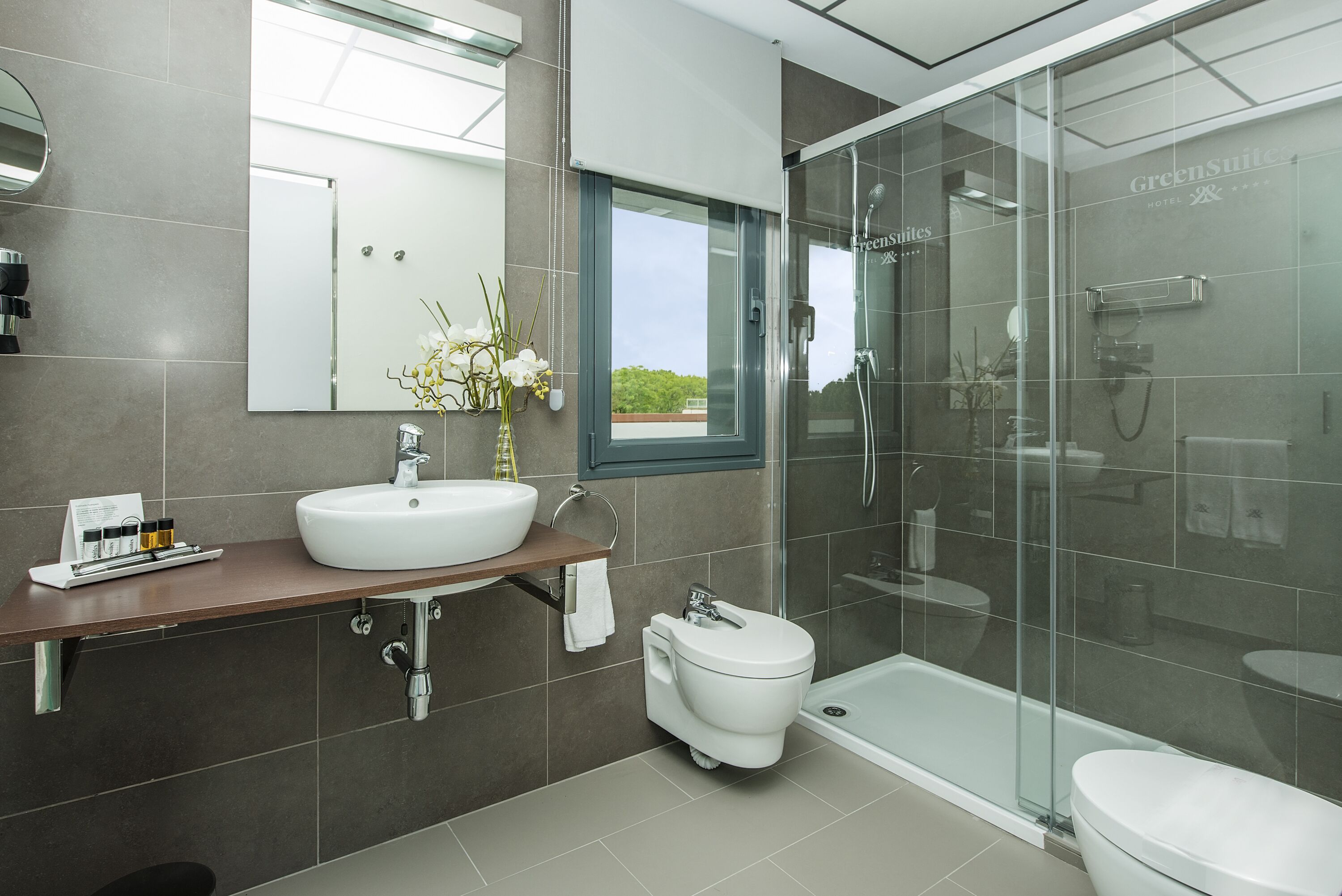 junior suite | bathroom | shower, free toiletries, hair dryer, bidet