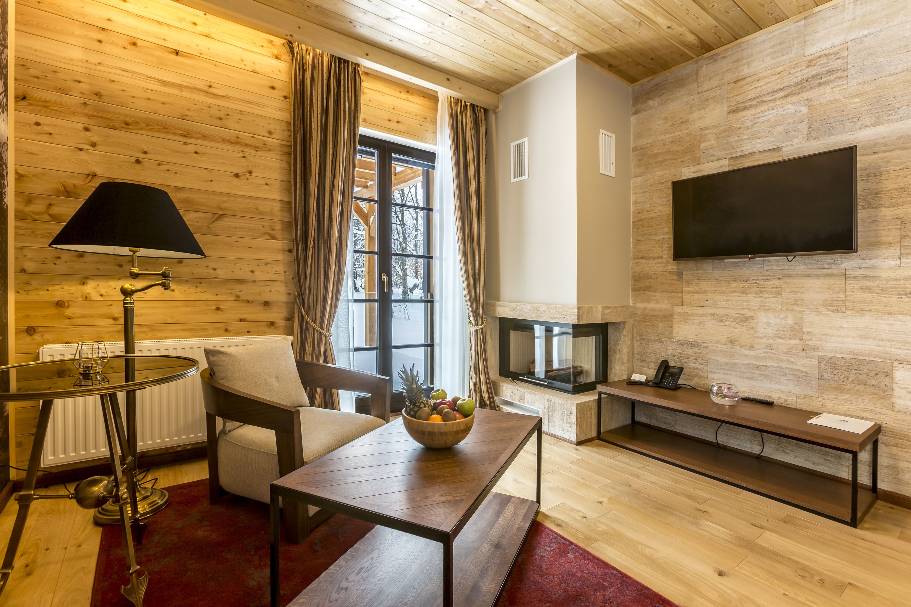 suite deluxe (one bedroom) | living area | plasma tv