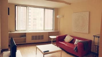 City Apartment, 1 Bedroom | Living room | Flat-screen TV, pay films