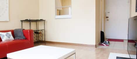 City Apartment, 1 Bedroom | Living room | Flat-screen TV, pay movies