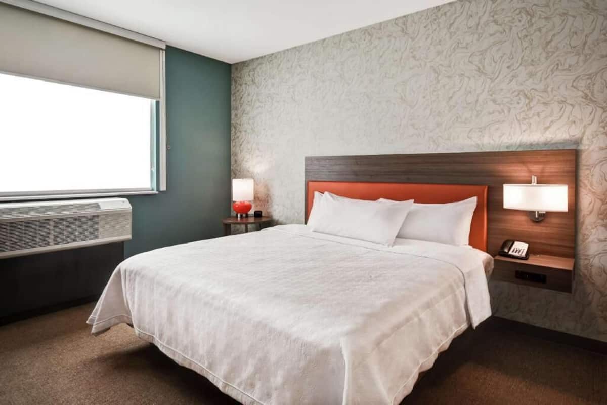 Hypo-allergenic bedding, pillow-top beds, desk, laptop workspace