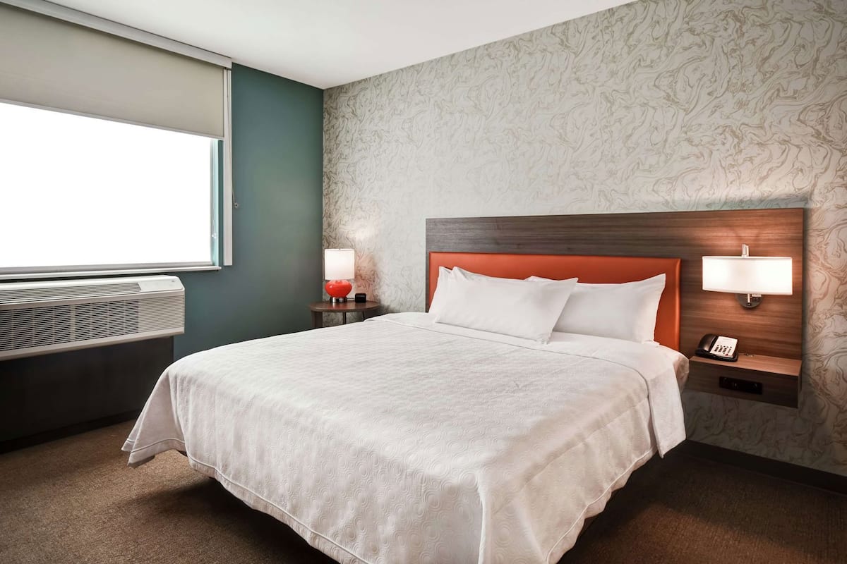 Hypo-allergenic bedding, pillow-top beds, desk, laptop workspace