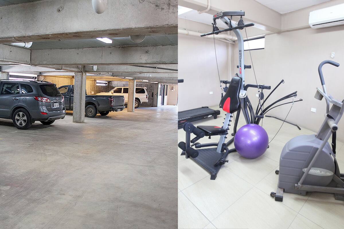 Un estacionamiento con vehículos y un gimnasio con equipo de ejercicio.
