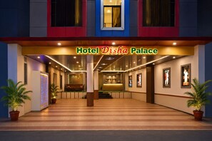 Hotel Disha Palace with a reception area, a seating area, and framed pictures on the walls. - Hotel Disha Palace (Rahata)
