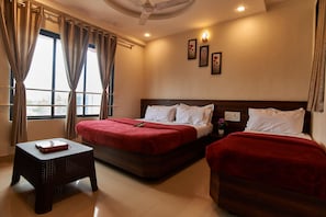 Deluxe Triple Room, Multiple Beds | Desk, iron/ironing board, rollaway beds, free WiFi - Hotel Disha Palace (Rahata)