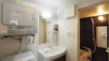 Separate bathtub and shower, free toiletries, hair dryer, slippers