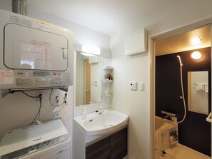Separate tub and shower, free toiletries, hair dryer, slippers - TOKI NO YADO NAHA by SUNREST RESORT (Naha)