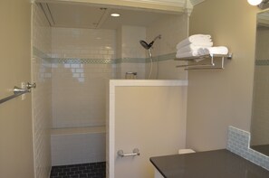 Bathtub, hair dryer, towels, soap