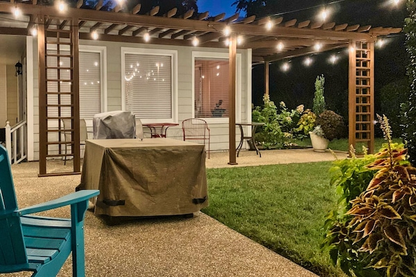 Patio area with firepit and gas grill.