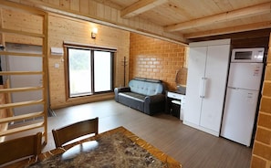 Traditional Duplex (Cypress and Red Clay Room) | Living room | Flat-screen TV