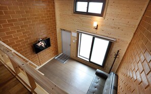 Traditional Duplex (Cypress and Red Clay Room) | Living room | Flat-screen TV
