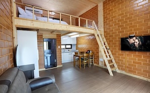 Traditional Duplex (Cypress and Red Clay Room) | Living area | Flat-screen TV