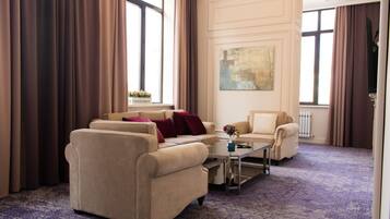 Luxury Double Room | Living room | Flat-screen TV