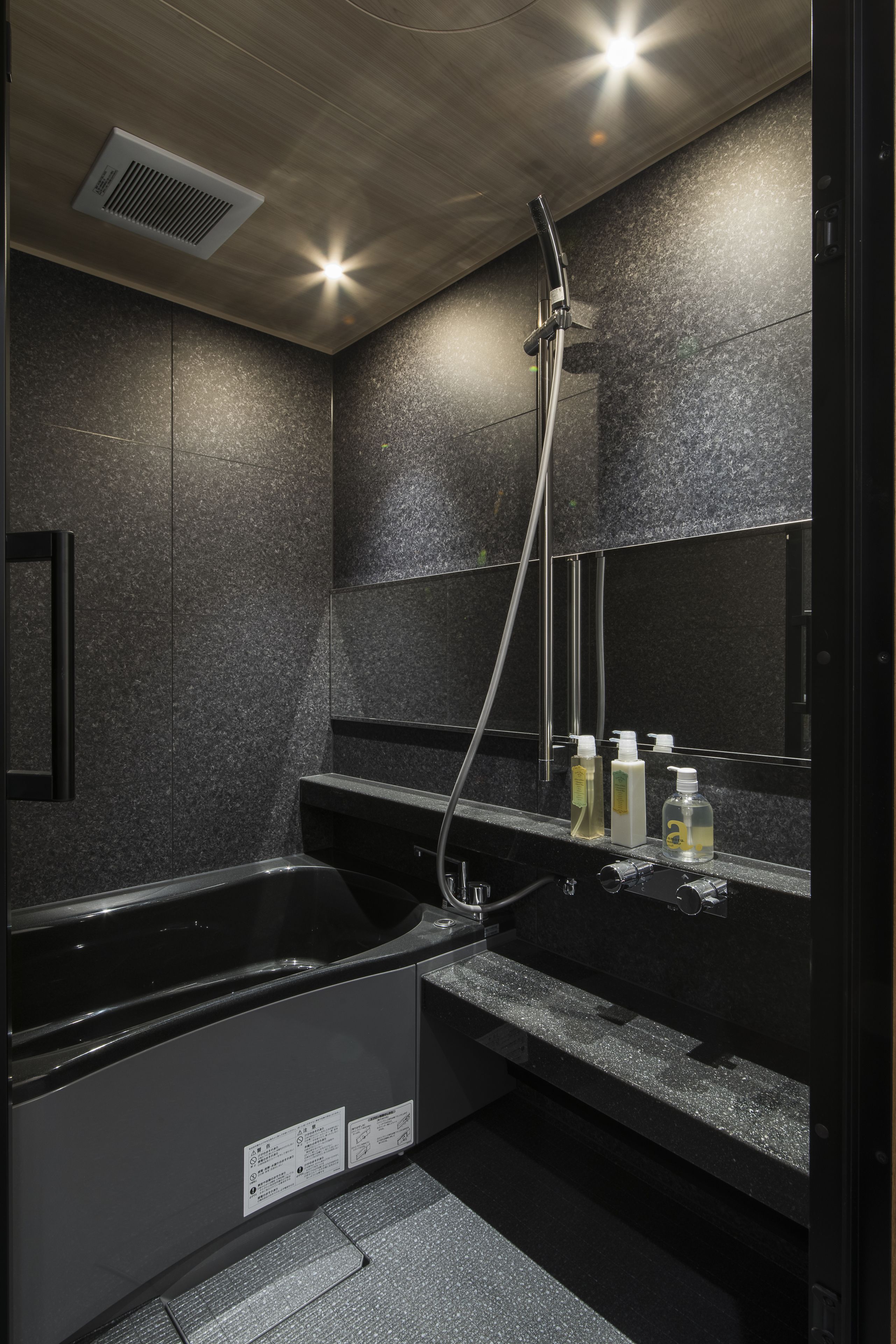 designer toiletries, hair dryer, slippers, bidet