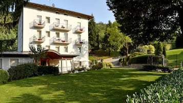Stroll through beautifully maintained gardens and enjoy the serene atmosphere of this traditional hotel, featuring balconies with flower boxes.