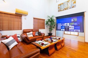 120-inch flat-screen TV with satellite channels, TV, video game console