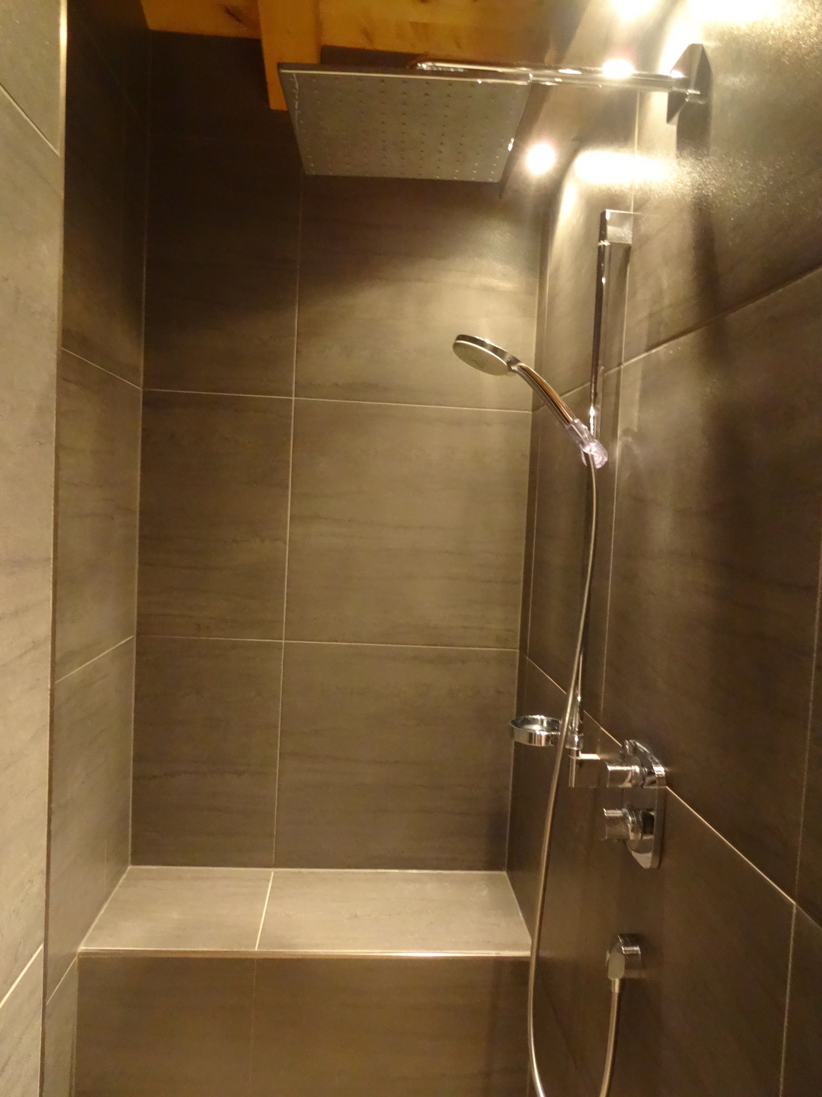 Bathtub, hair dryer, slippers, towels