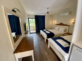 Luxury Triple Room, Partial Sea View | Desk, free WiFi