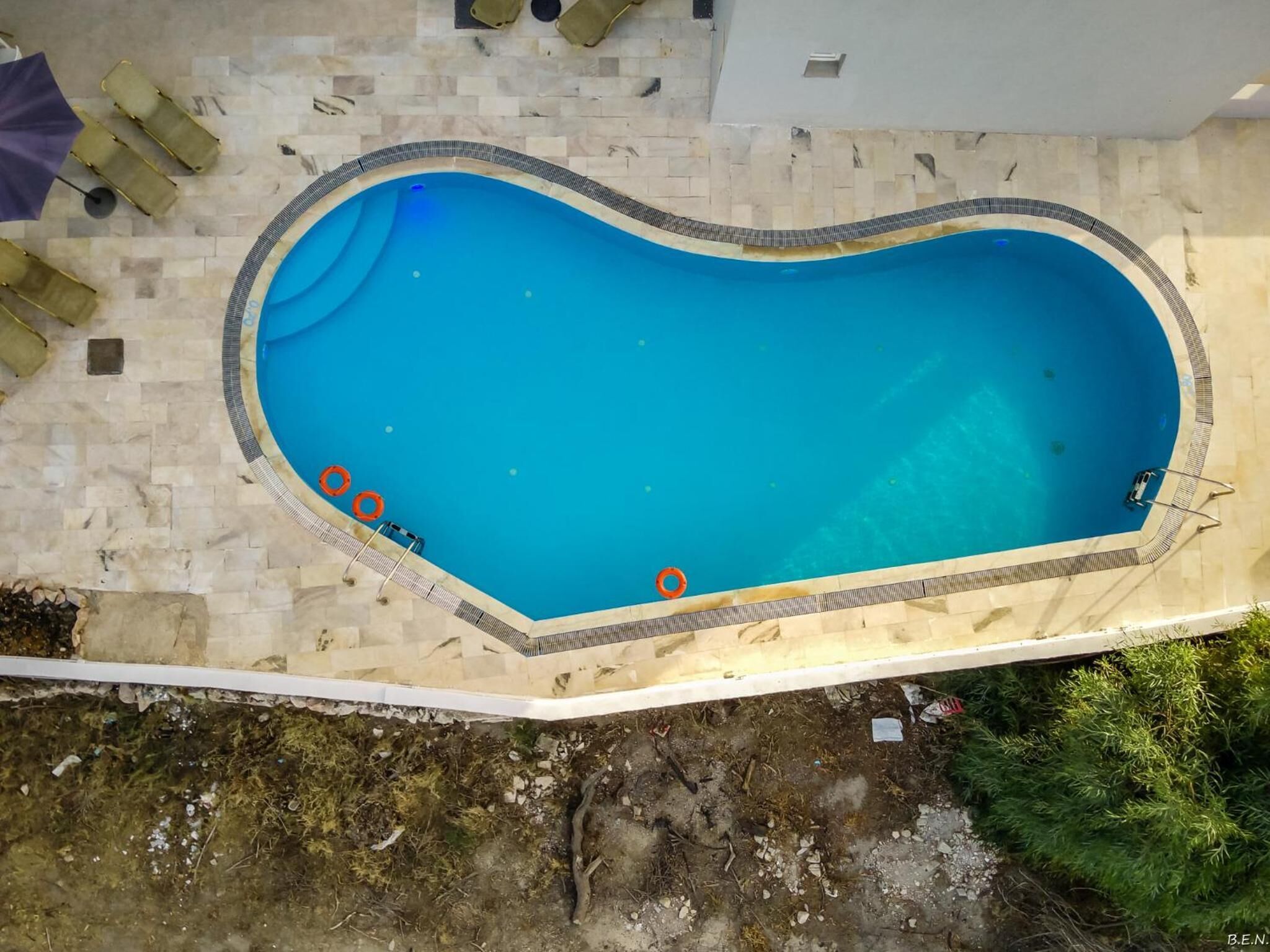 outdoor pool, pool umbrellas, pool loungers