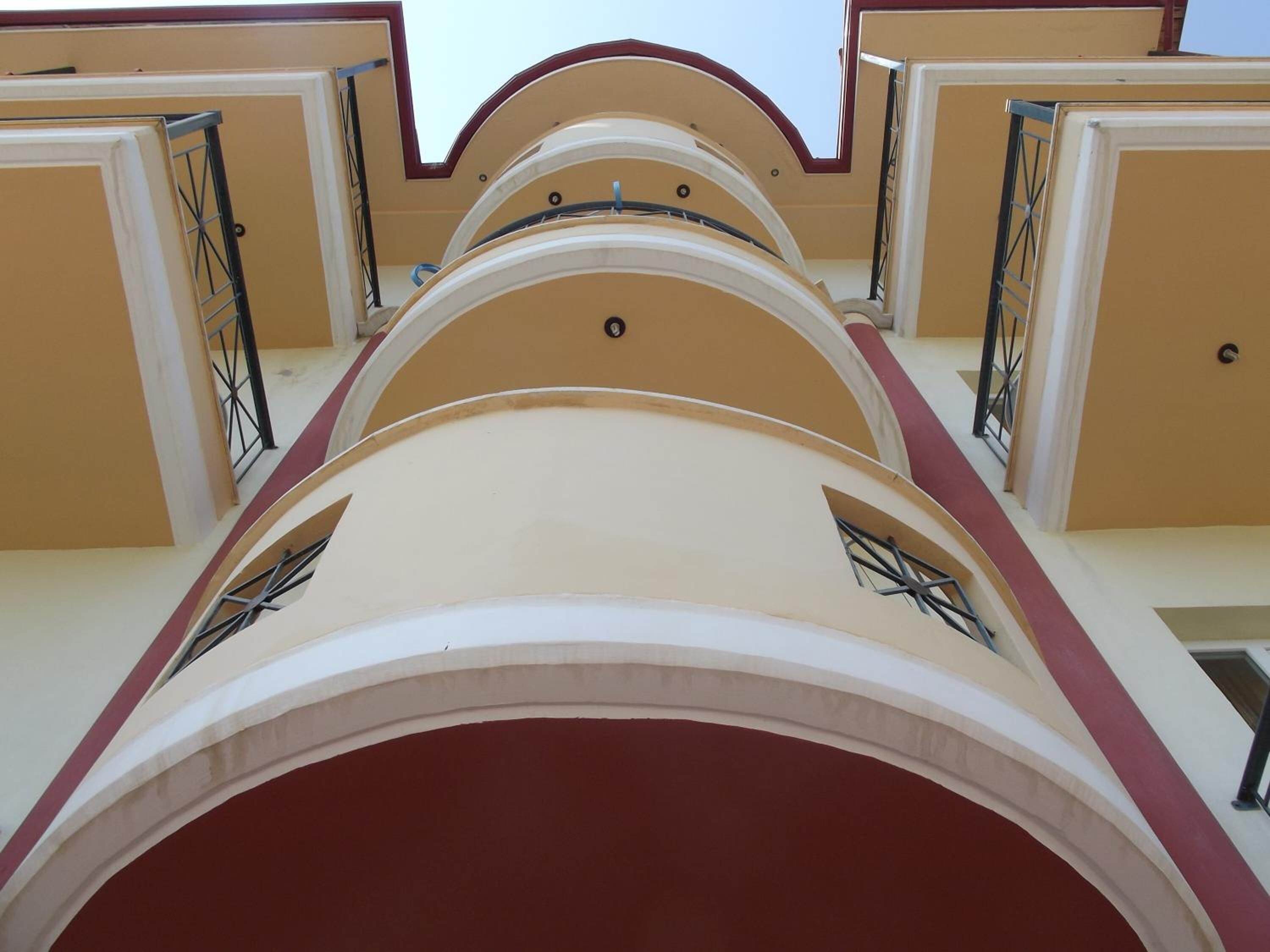 A multi-level building with a series of balconies.