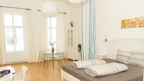 A bedroom with a bed, a desk, a chair, and a window. - Vienna Hotspot - Museum (Vienna)