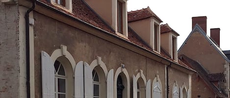 A historic building with arched windows and a traditional facade.