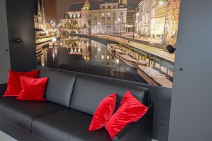 Exclusive Penthouse, 1 King Bed with Sofa bed, City View | Living area | Flat-screen TV