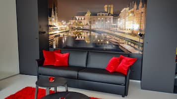 Exclusive Penthouse, 1 King Bed with Sofa bed, City View | Living area | Flat-screen TV