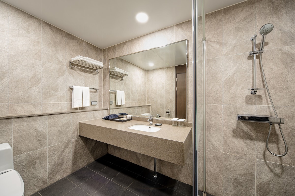 hair dryer, bathrobes, slippers, bidet