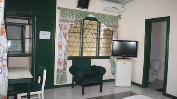 Deluxe Double Room, 1 Double Bed | Living area | TV