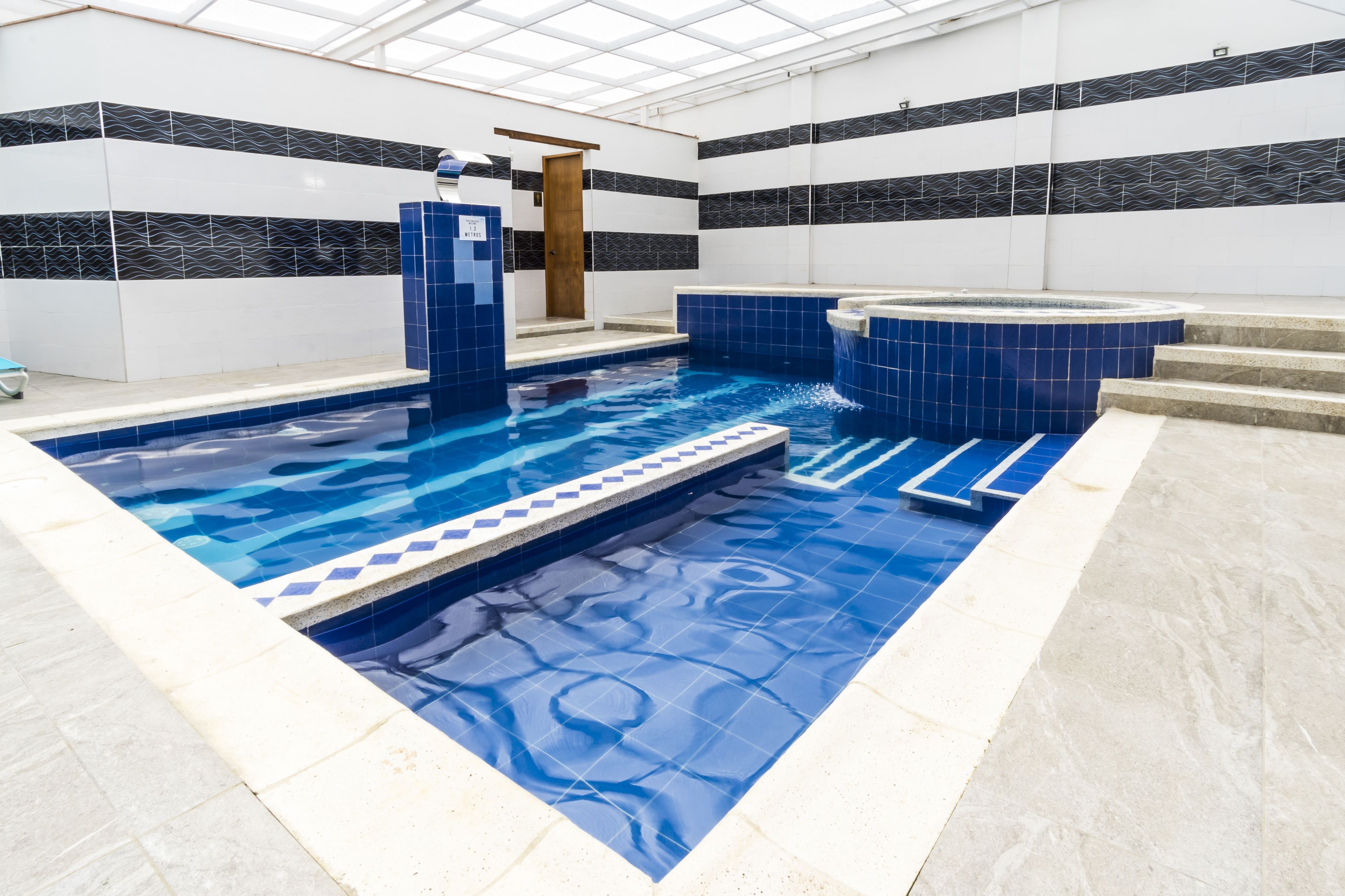 indoor pool, open 10:00 am to 8:00 pm, pool loungers