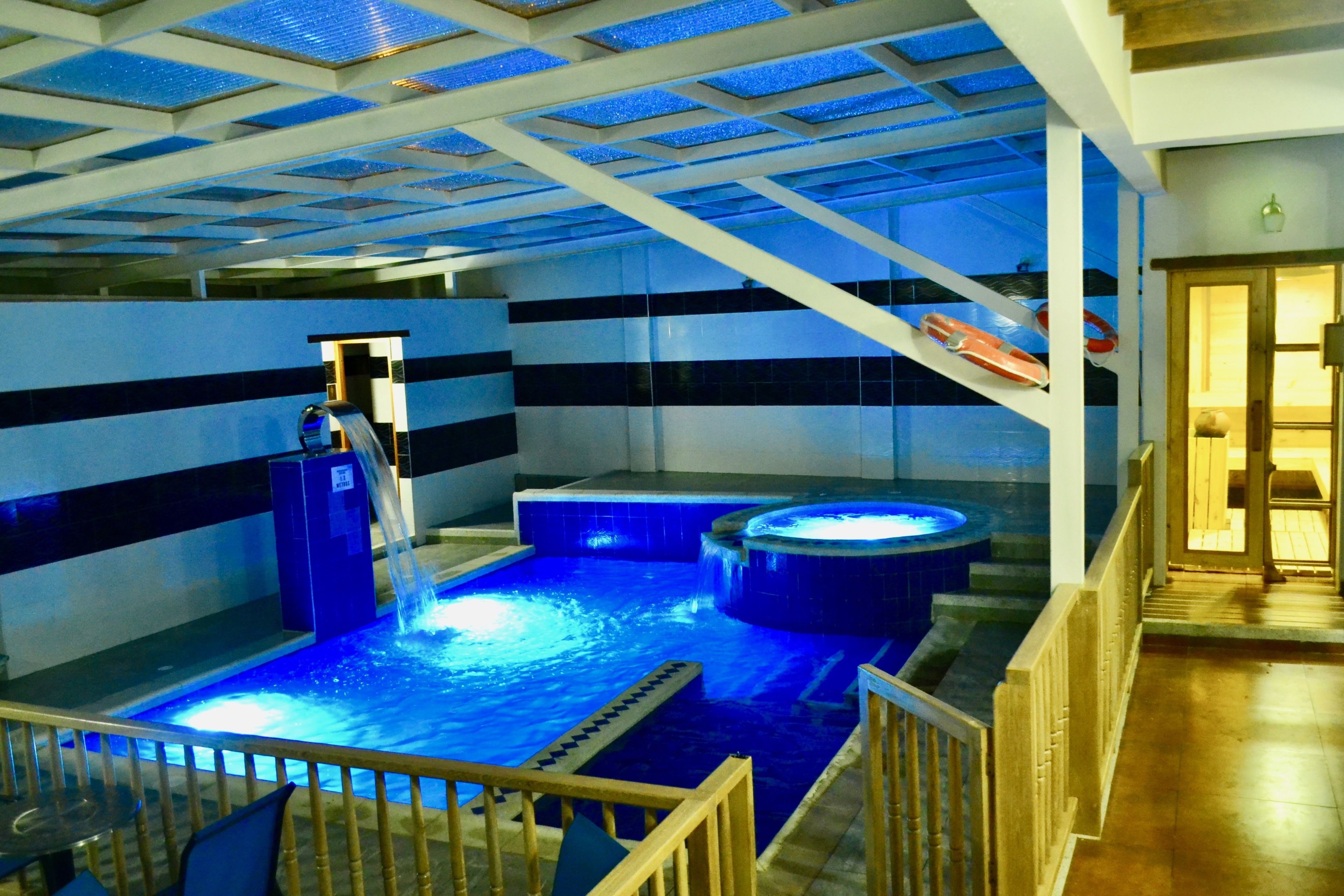 Indoor pool, open 10:00 AM to 8:00 PM, pool loungers