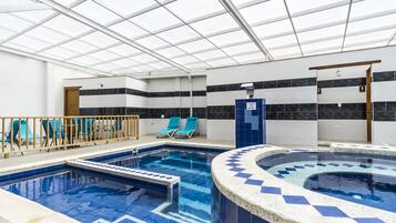 Indoor pool, open 10:00 AM to 8:00 PM, pool loungers