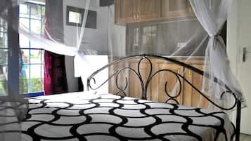 Desk, iron/ironing board, bed sheets