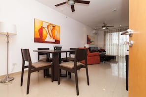 Condo, City View | Living area | Flat-screen TV