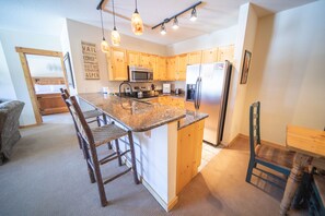 Design Condo, 2 Bedrooms, Balcony, Mountain View (Tenderfoot Lodge 2643) | Private kitchen | Fridge, coffee/tea maker, cookware/dishes/utensils, freezer - Tenderfoot Lodge 2643 (Keystone)
