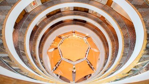 A multi-level atrium with a central open space surrounded by concentric balconies. - Hyatt Place Hyderabad Banjara Hills (Hyderabad)