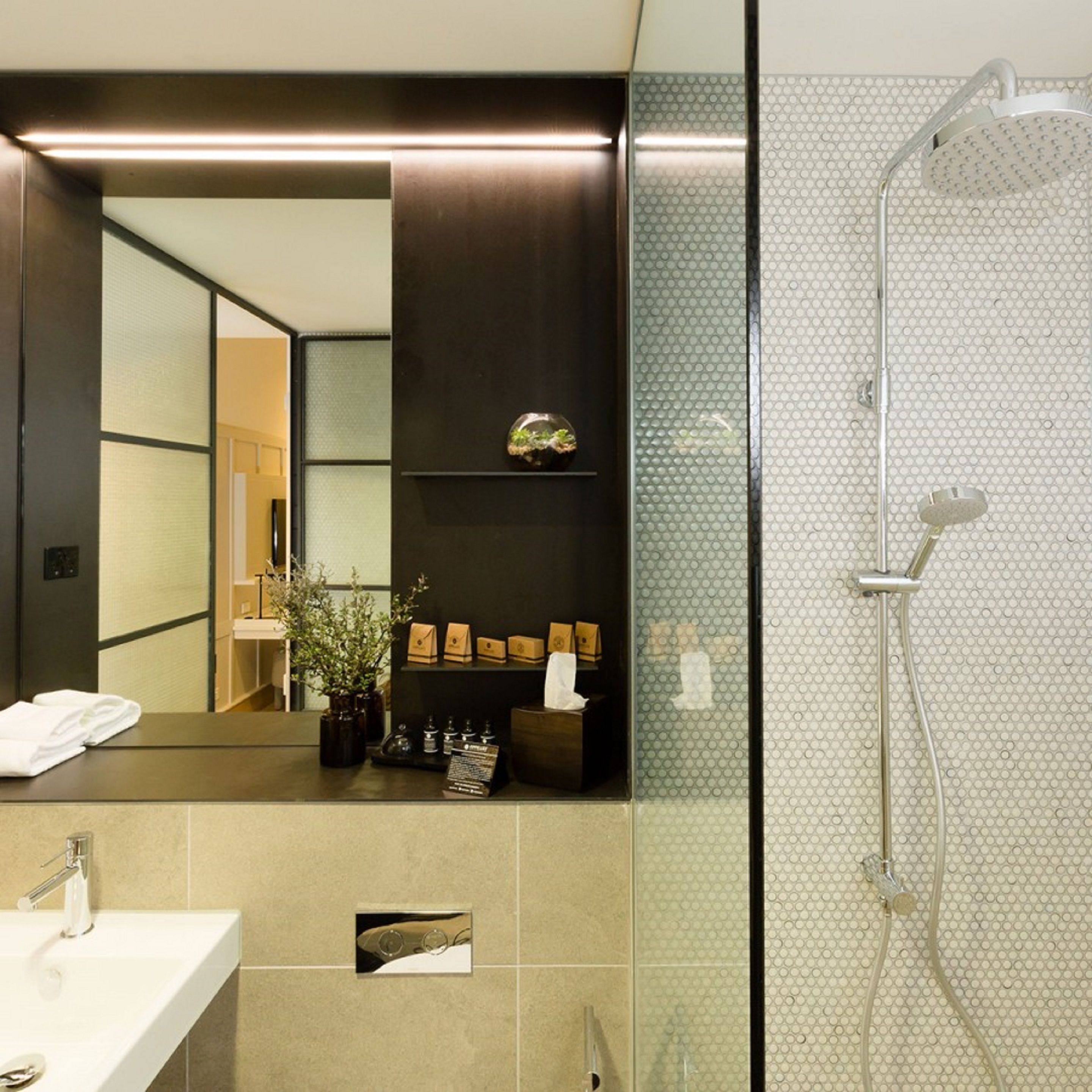 deluxe queen room - accessible | bathroom | shower, designer toiletries, hair dryer, bathrobes