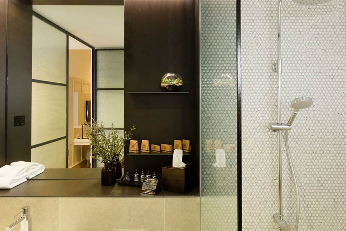 deluxe queen room - accessible | bathroom | shower, designer toiletries, hair dryer, bathrobes