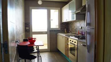 Apartment, 1 Bedroom | Private kitchen | Full-size fridge, microwave, oven, stovetop