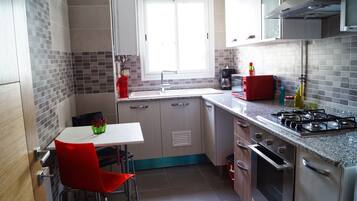 Apartment, 1 Bedroom | Private kitchen | Full-size fridge, microwave, oven, stovetop