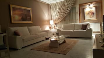 Apartment, 2 Bedrooms | Living room | 42-inch flat-screen TV with satellite channels, TV