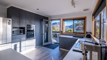 4 Bedroom Family House with stunning Ocean Views | Private kitchen | Coffee/tea maker, full-sized fridge, oven, stovetop