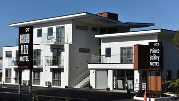 Two distinct sections of the motel offer a modern, minimalist design with clean lines and large windows.