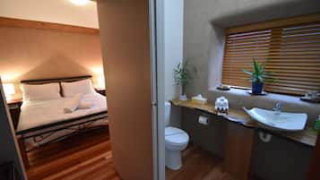 Stylish Straw Bale Studio with Sun Deck and Sea Views | Bathroom | Shower, hair dryer, towels, shampoo