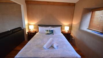 Stylish Straw Bale Studio with Sun Deck and Sea Views | 1 bedroom, premium bedding, iron/ironing board, travel crib