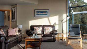 Elevated 3 Bedroom House with stunning Ocean Views | Living area | Flat-screen TV, DVD player