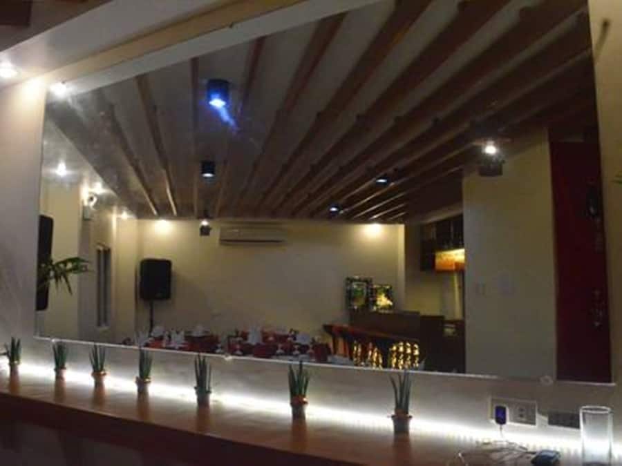 Breakfast, lunch served; local and international cuisine, garden views