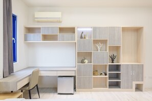 Standard Quadruple Room | Living room | Flat-screen TV